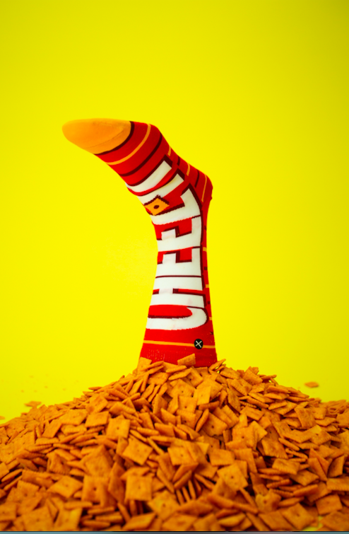 cheez-it socks in a pile of cheez-its