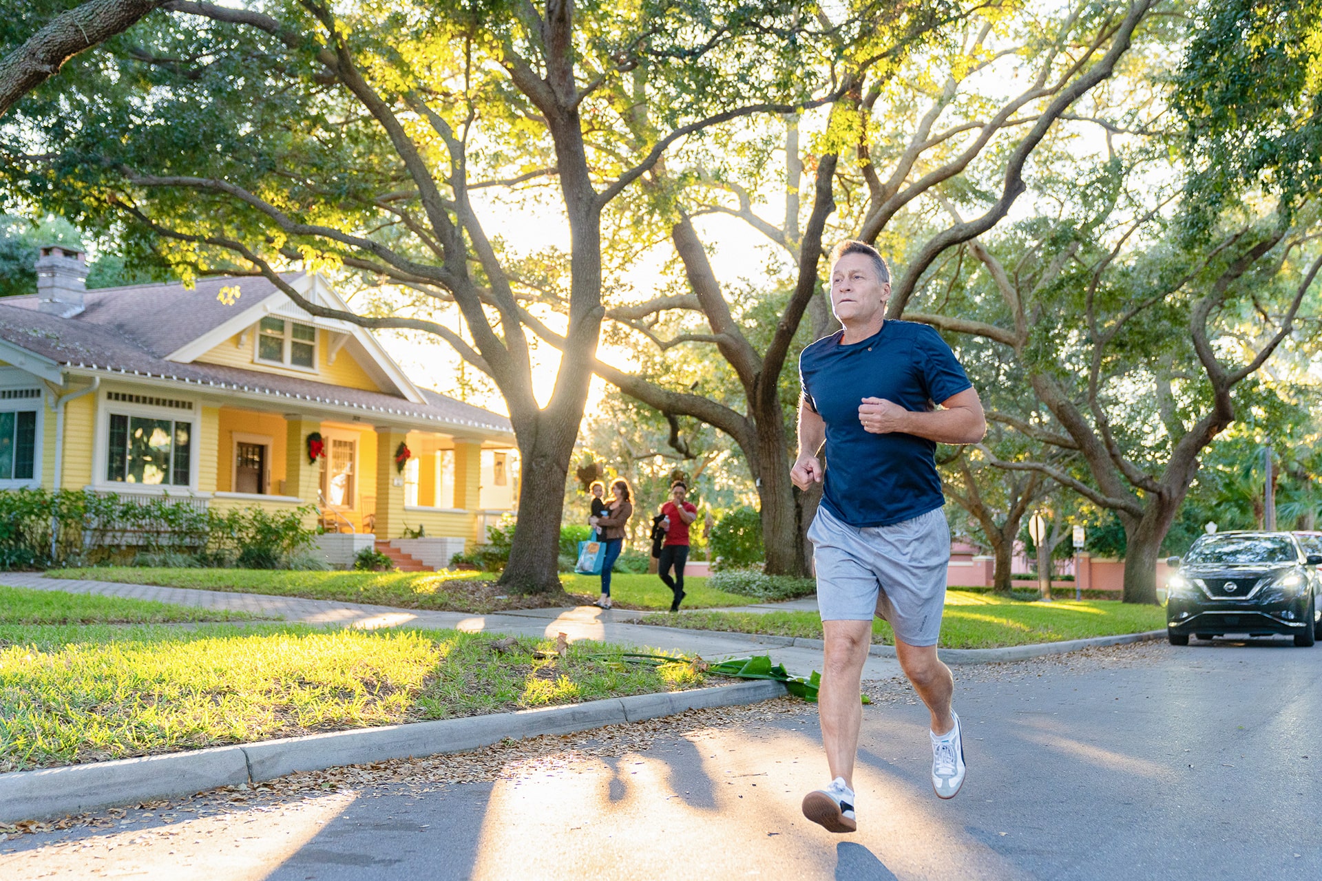 man jogging in suburban neighborhood